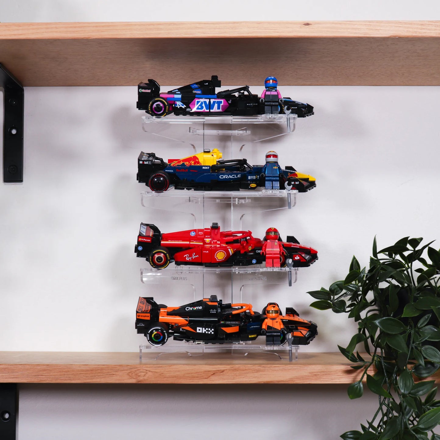Brix Plus 4-Car acrylic display stand showing four LEGO® Speed Champions cars stacked vertically