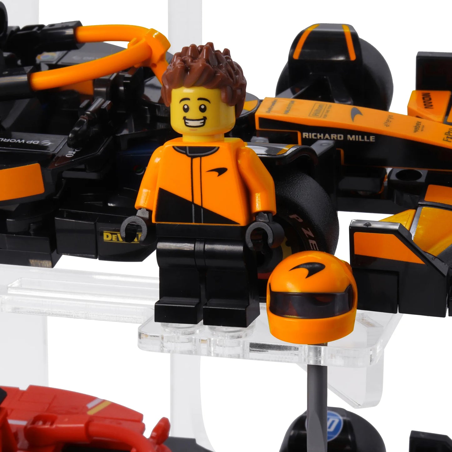 Brix Plus 4-Car LEGO® Speed Champions display stand on a desk with collectibles